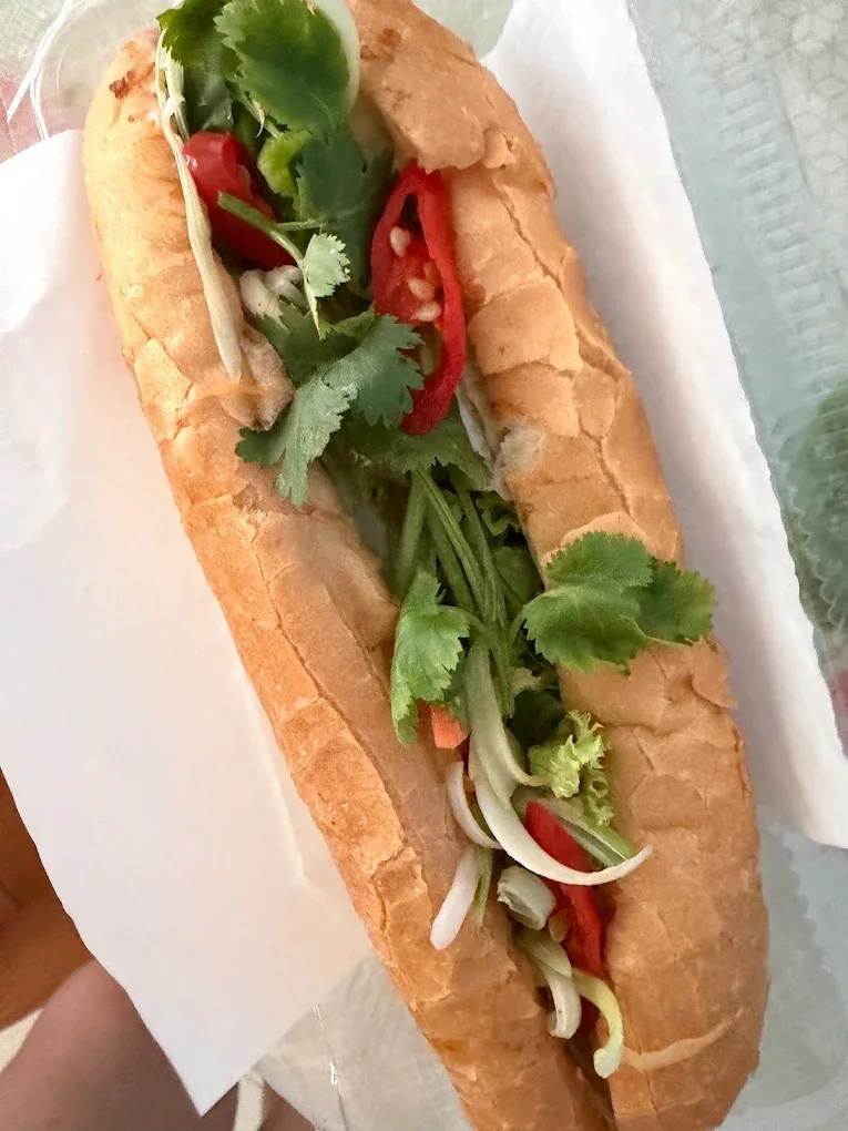 Grilled pork bánh mì with chili, cucumber and coriander